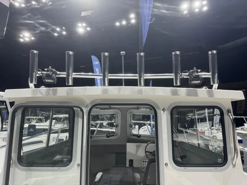 Slide: The Image of 2024 Defiance 260 Admiral EX boat interior with seating and glass door. - 30