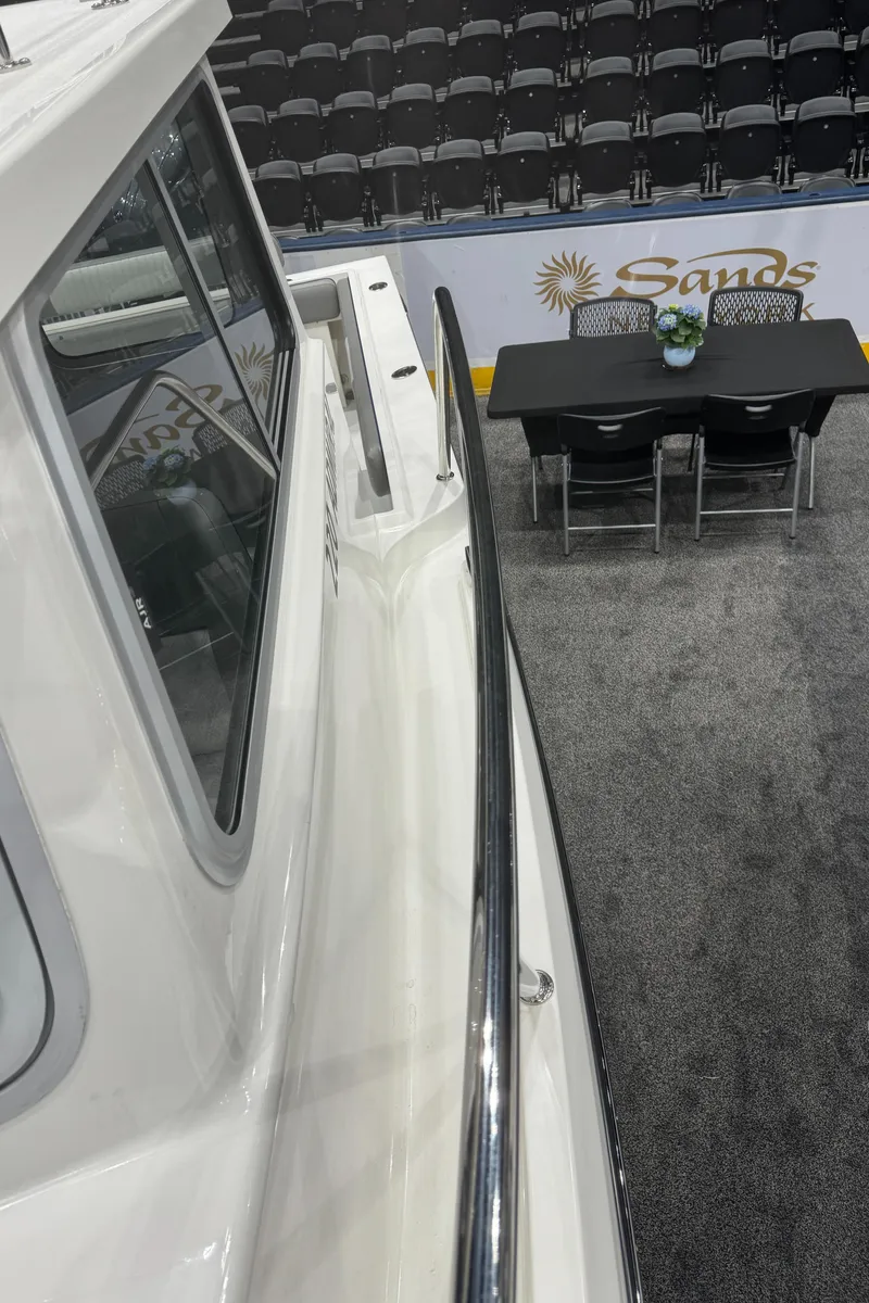 Slide: The Image of 2024 Defiance 260 Admiral EX boat on display at an indoor event. - 41