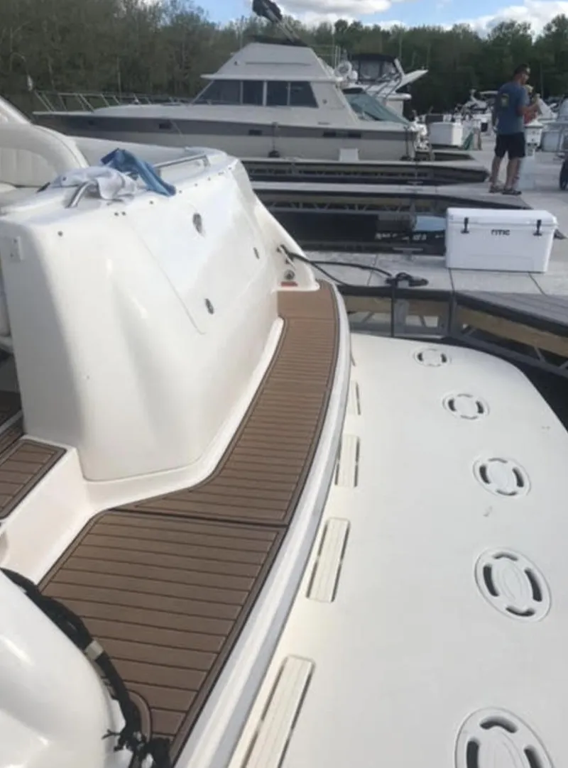 Slide: The Image of 1996 Sea Ray 450 Sundancer docked at a marina. - 6