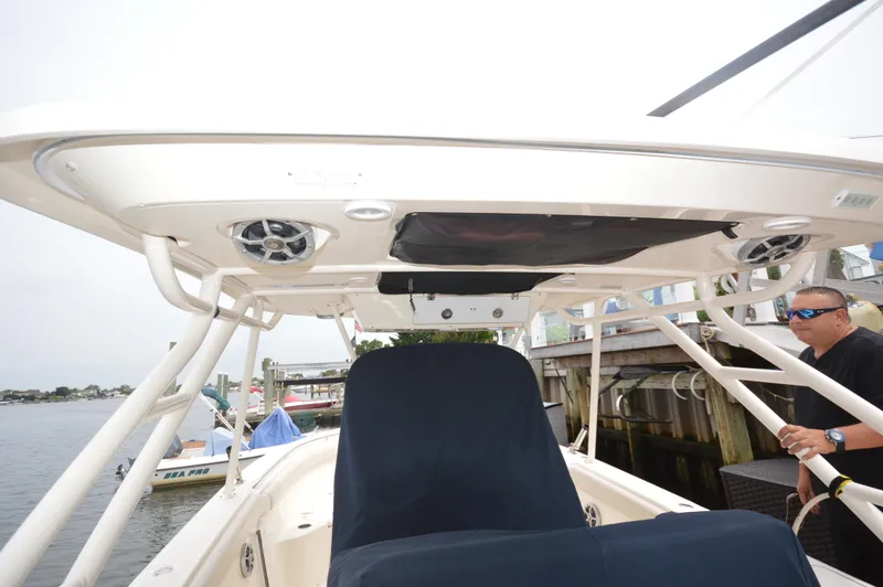 Slide: The Image of 2012 Pursuit 280 boat interior with T-top and electronics. - 11