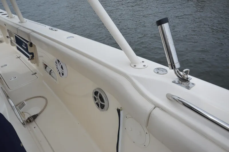 Slide: The Image of 2012 Pursuit 280 boat deck with rod holder and speakers. - 21