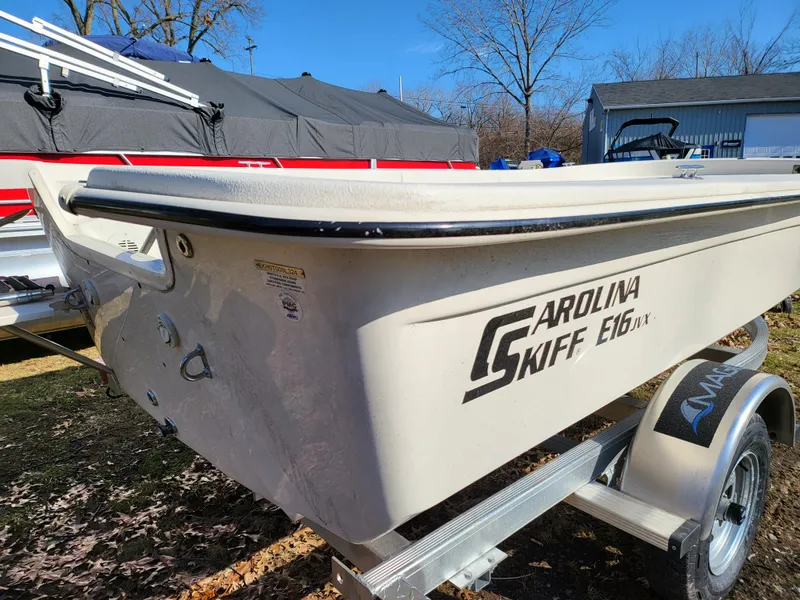 Slide: The Image of 2024 Carolina Skiff E16 JVX TH boat on trailer, side view. - 3