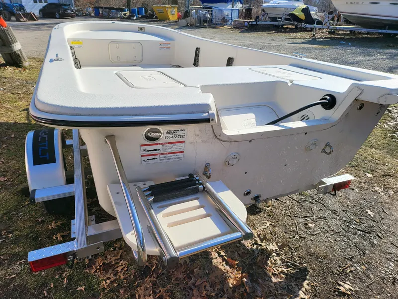 Slide: The Image of 2024 Carolina Skiff E16 JVX TH boat rear view with swim ladder. - 5