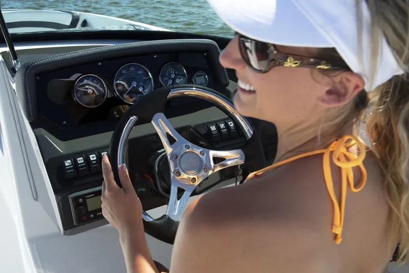 Slide: The Image of 2024 Monterey M-225 boat interior with cushioned seating and modern design. - 3