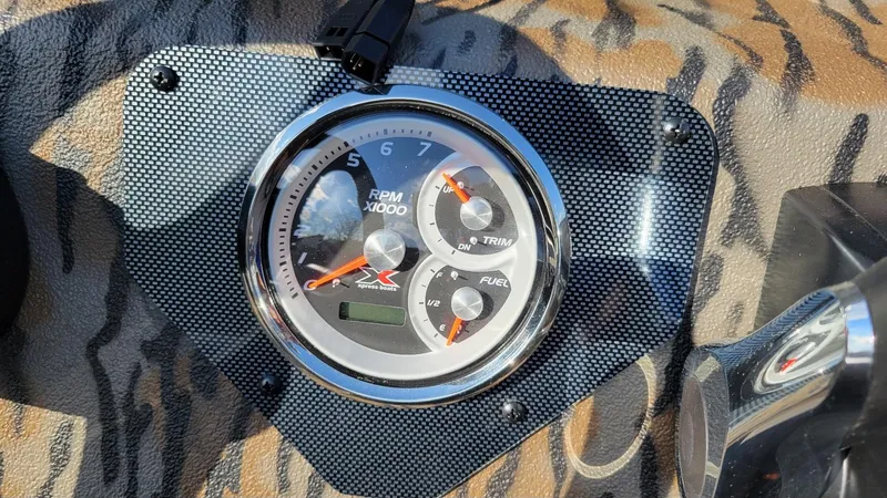 Slide: The Image of Tachometer of 2025 Xpress XP20CC boat with Yamaha Vmax 90 engine, tiger-patterned dashboard. - 8