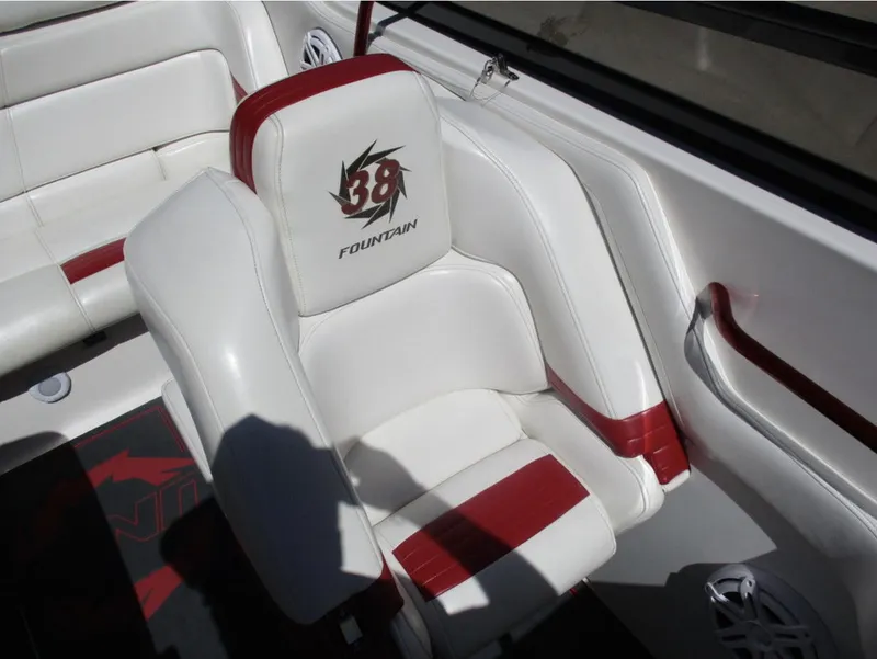 Slide: The Image of 2003 Fountain 38 Lightning boat interior with white and red seating. - 11