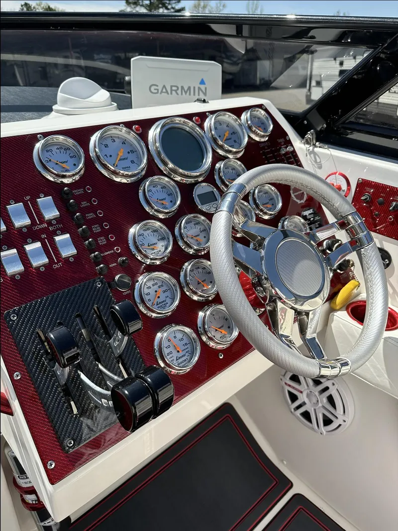 Slide: The Image of 2003 Fountain 38 Lightning boat dashboard with Garmin navigation system. - 13