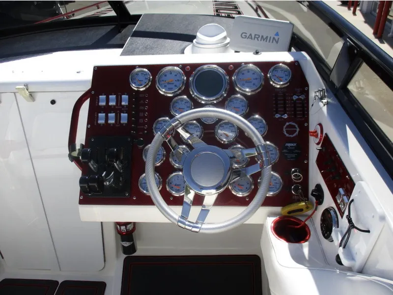 Slide: The Image of 2003 Fountain 38 Lightning boat dashboard with Garmin navigation system. - 14