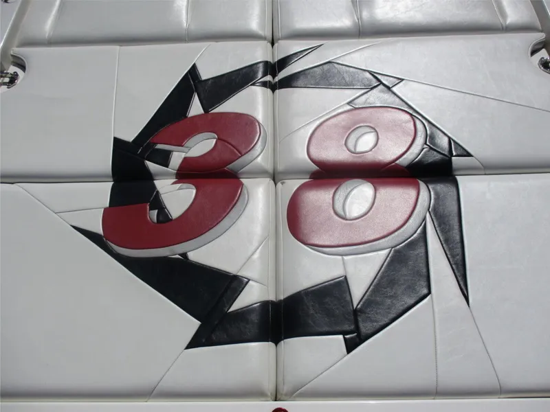 Slide: The Image of 2003 Fountain 38 Lightning boat seat with red and black 38 design. - 16