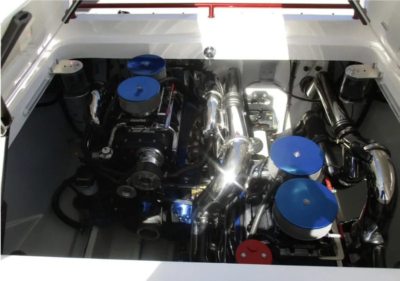 Slide: The Image of 2003 Fountain 38 Lightning engine compartment with dual engines and blue accents. - 21