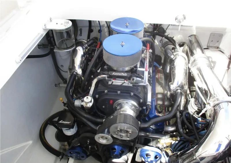 Slide: The Image of 2003 Fountain 38 Lightning engine compartment with dual air filters and chrome components. - 22