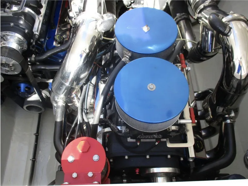 Slide: The Image of 2003 Fountain 38 Lightning engine with dual blue air filters and chrome components. - 23