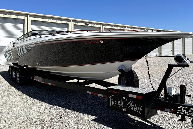 Slide: The Image of 2003 Fountain 38 Lightning speedboat on a trailer in storage facility. - 3