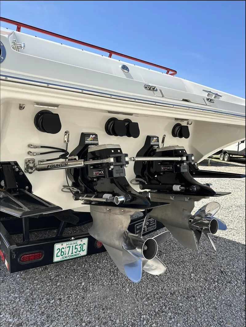Slide: The Image of 2003 Fountain 38 Lightning boat stern with dual propellers and Arizona license plate. - 6