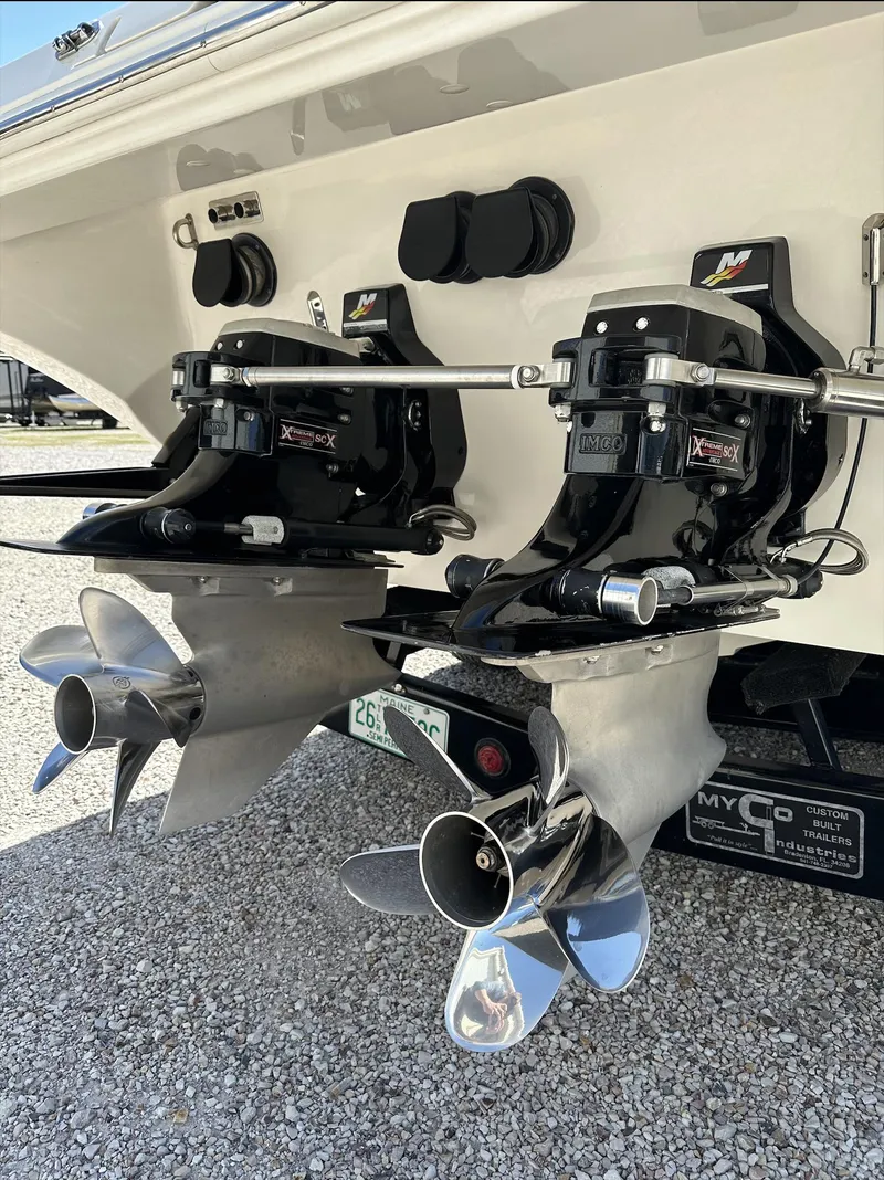 Slide: The Image of 2003 Fountain 38 Lightning boat with dual propellers and outboard motors. - 8