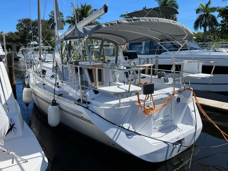 Slide: The Image of 2024 Catalina 355 sailboat docked in marina, featuring sleek design and modern amenities. - 0