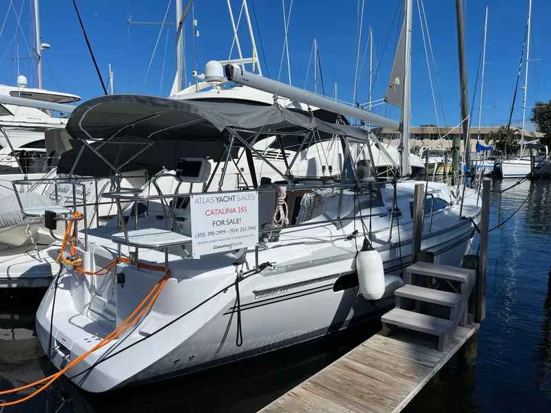 Slide: The Image of 2024 Catalina 355 sailboat docked, available for sale, featuring sleek design and modern amenities. - 1