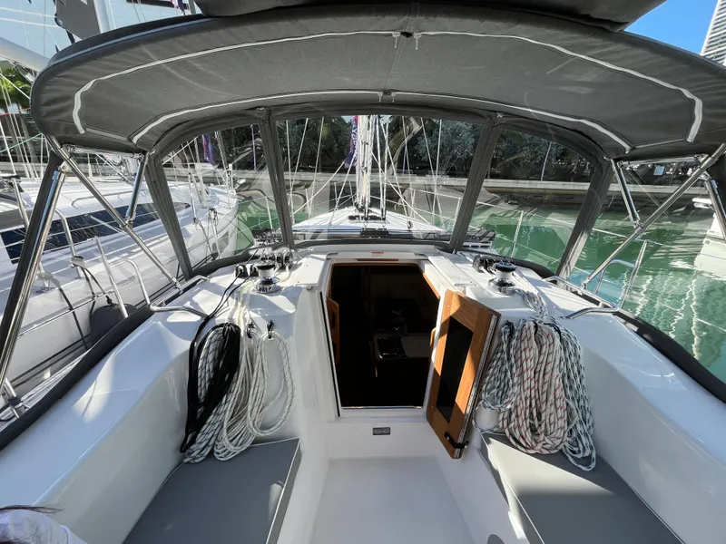 Slide: The Image of 2024 Catalina 355 sailboat cockpit with ropes and open cabin door. - 9