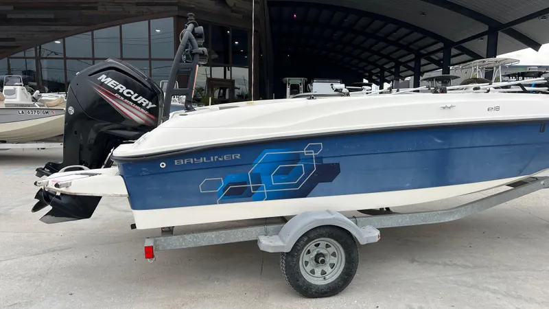 Slide: The Image of 2017 Bayliner Element E 18 boat on trailer with Mercury outboard motor. - 3