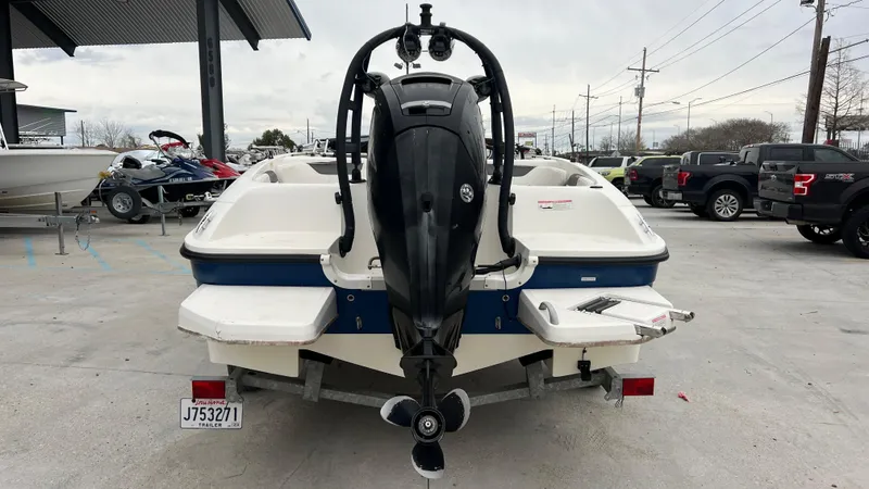 Slide: The Image of 2017 Bayliner Element E 18 boat rear view with outboard motor. - 4