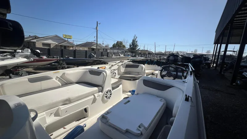 Slide: The Image of 2017 Bayliner Element E 18 boat interior with seating and steering wheel. - 8