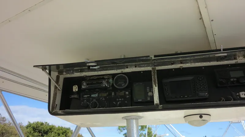 Slide: The Image of 1986 Post Sportfisher control panel with navigation instruments and gauges. - 25