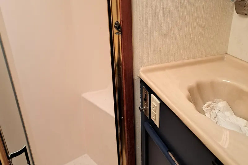 Slide: The Image of 1986 Post Sportfisher bathroom with shower and sink. - 28