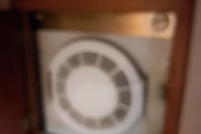 Slide: The Image of Blurry image of a ventilation fan inside a 1986 Post Sportfisher boat. - 30