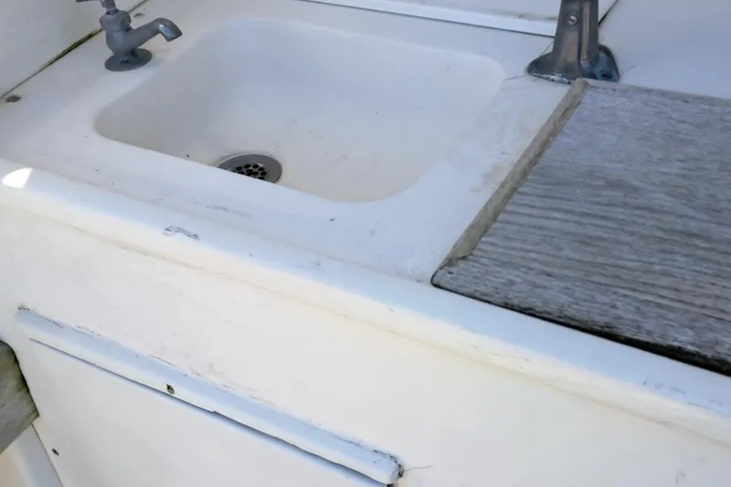 Slide: The Image of 1986 Post Sportfisher boat sink and faucet in white - 33