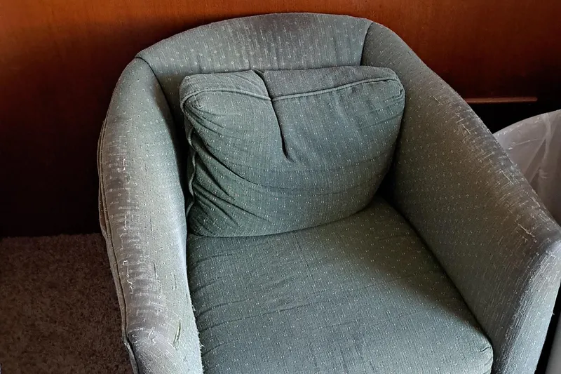Slide: The Image of Green cushioned chair in 1986 Post Sportfisher boat interior. - 35