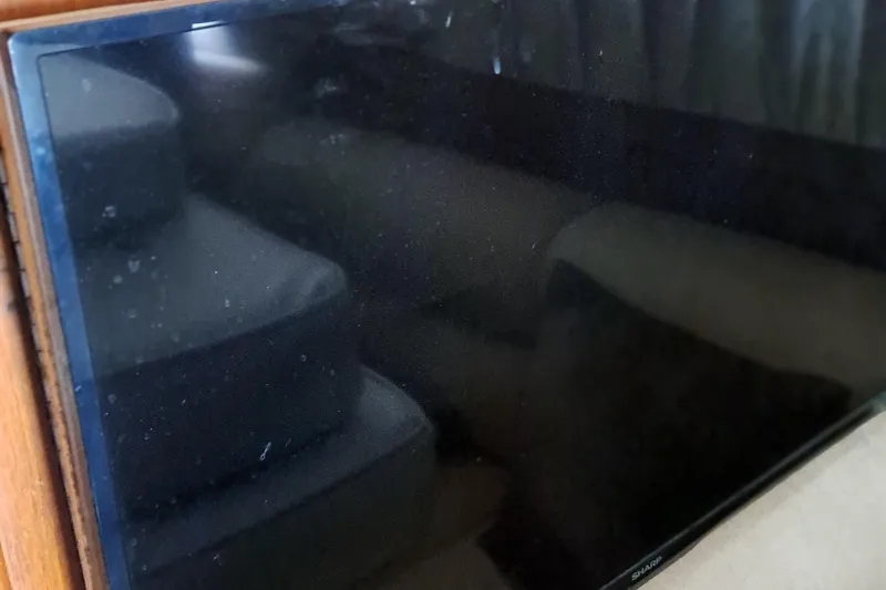 Slide: The Image of Flat-screen TV inside 1986 Post Sportfisher boat cabin. - 36