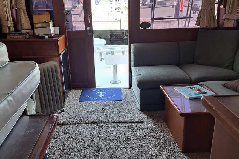 Slide: The Image of Interior of a 1986 Post Sportfisher yacht with cozy seating and nautical decor. - 42