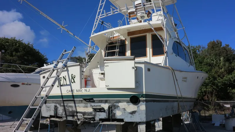 Slide: The Image of 1986 Post Sportfisher boat on land, Cape May, NJ, with clear blue sky. - 5