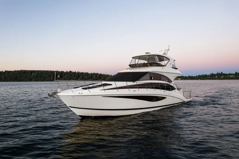 Slide: The Image of 2012 Meridian 541 Sedan yacht cruising on calm waters at sunset. - 16