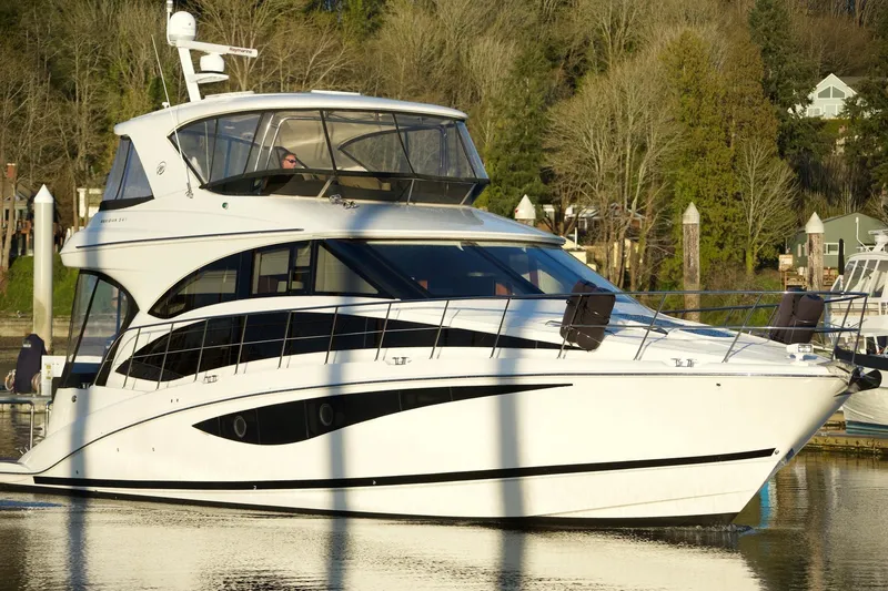Slide: The Image of 2012 Meridian 541 Sedan yacht cruising on a calm waterway. - 19