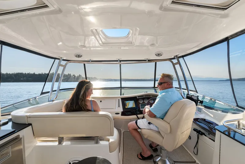 Slide: The Image of 2012 Meridian 541 Sedan interior with two people enjoying a scenic boat ride. - 26