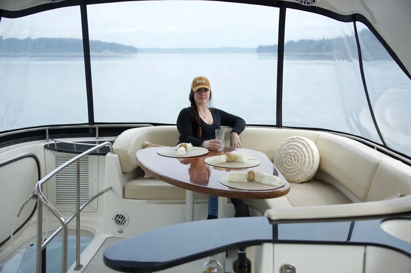 Slide: The Image of Woman relaxing on a 2012 Meridian 541 Sedan yacht with scenic water view. - 31