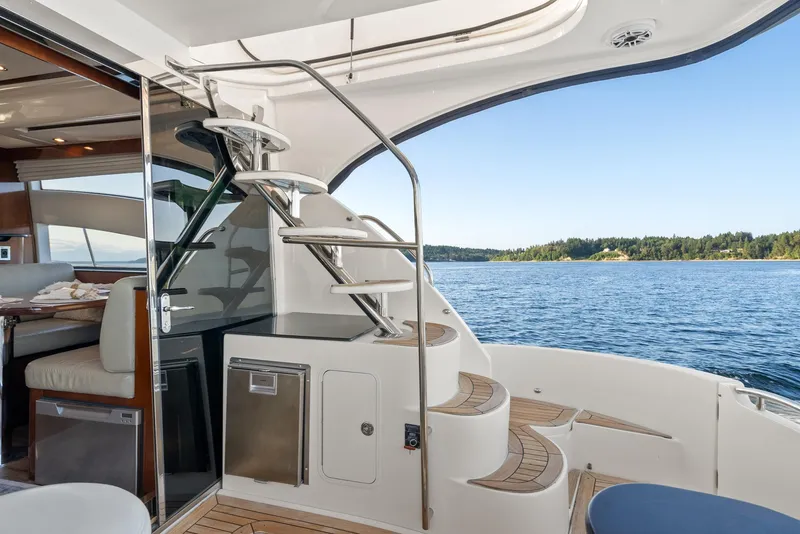 Slide: The Image of Luxurious 2012 Meridian 541 Sedan yacht interior with spiral staircase and scenic ocean view. - 35