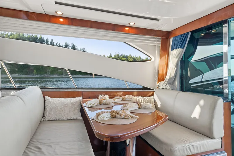 Slide: The Image of Luxurious interior of 2012 Meridian 541 Sedan yacht with dining area and scenic view. - 37