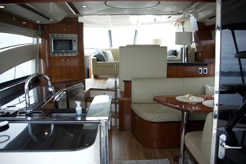Slide: The Image of Luxurious interior of 2012 Meridian 541 Sedan yacht with modern kitchen and seating area. - 40