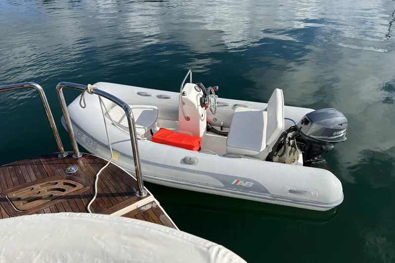 Slide: The Image of Small inflatable boat with Yamaha motor docked beside a 2012 Meridian 541 Sedan. - 66