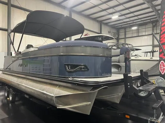 Slide: The Image of 2024 Avalon Catalina Rear J Lounger 23 FT pontoon boat in showroom. - 1