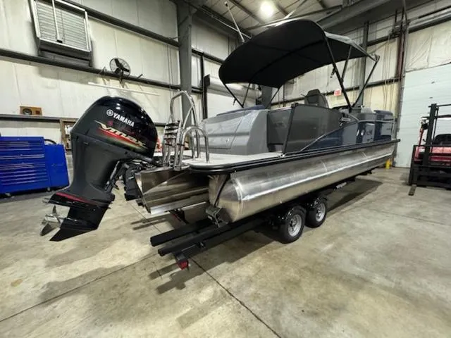 Slide: The Image of 2024 Avalon Catalina Rear J Lounger 23 FT pontoon boat in a warehouse. - 10