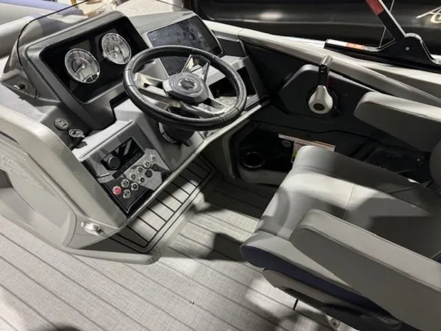 Slide: The Image of 2024 Avalon Catalina Rear J Lounger with Yamaha 175 HP outboard motor in a showroom. - 12