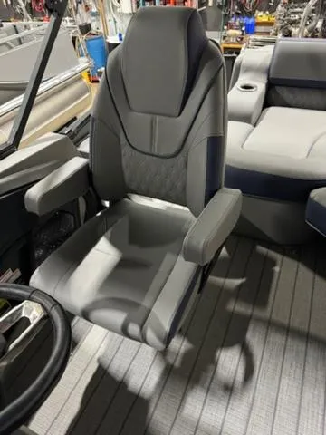 Slide: The Image of 2024 Avalon Catalina Rear J Lounger boat with motor and ladder in workshop. - 14