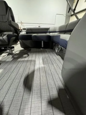 Slide: The Image of 2024 Avalon Catalina Rear J Lounger interior with cup holders and sleek seating. - 18