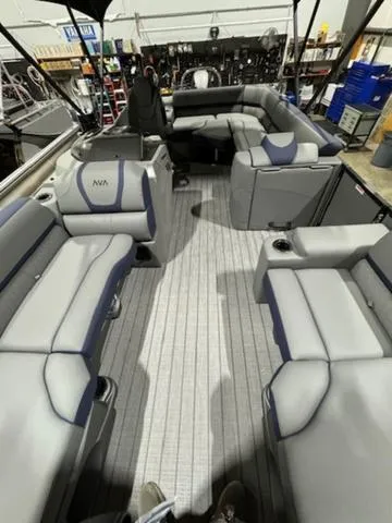 Slide: The Image of 2024 Avalon Catalina Rear J Lounger 23 FT interior with plush seating and modern design. - 21