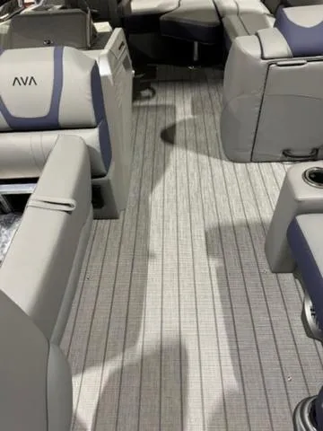 Slide: The Image of 2024 Avalon Catalina Rear J Lounger 23 FT interior with luxurious seating and modern design. - 24