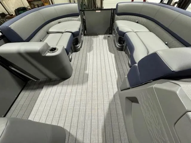 Slide: The Image of 2024 Avalon Catalina Rear J Lounger 23 FT interior with stylish seating and flooring. - 25