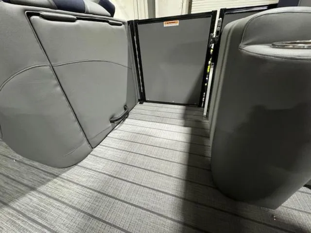 Slide: The Image of 2024 Avalon Catalina Rear J Lounger 23 FT interior with speakers and seating. - 26